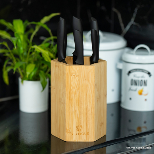 STYLIQUE bamboo hexagonal magnetic knife holder displaying kitchen knives on a benchtop
